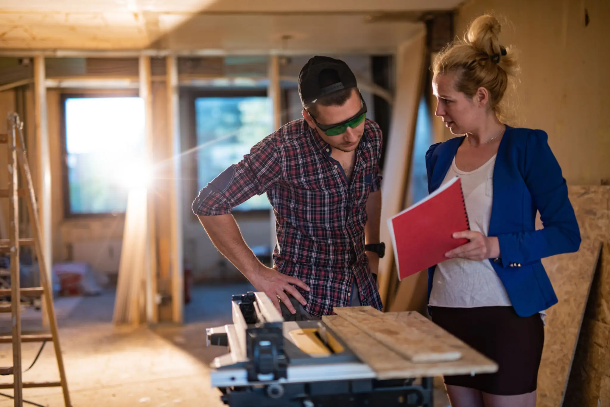 Contractor and client discussing home renovation plans