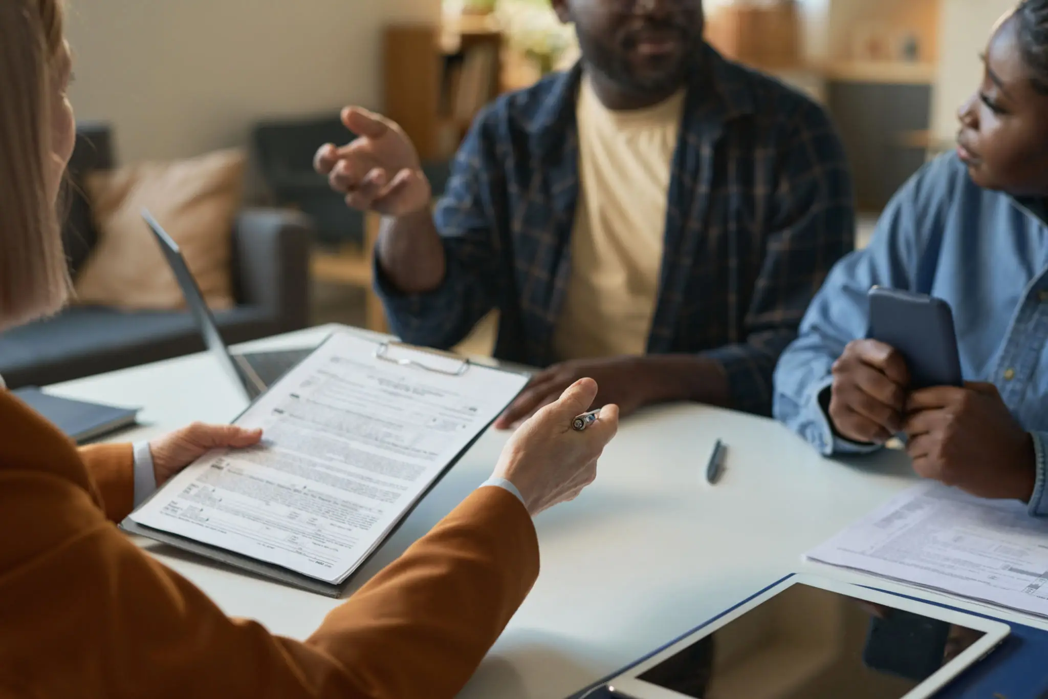 Financial advisor reviewing documents with clients